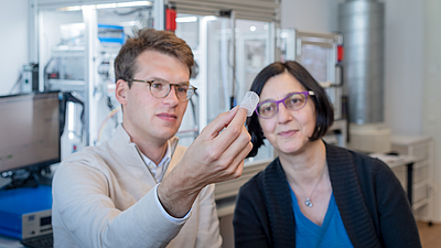 Petra Mela, Professor of Medical Materials and Implants at the Technical University of Munich (TUM) and doctoral candidate Kilian Meuller examine an artificial heart valve produced with the additive manufacturing technology melt electrowriting. Image: Andreas Heddergott / TUM